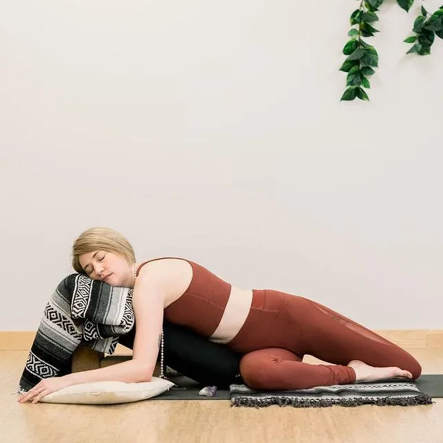 Reclining Twist with a Bolster (Supported Bharadvaja Twist Pose) - Sharp Muscle
